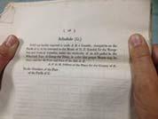 Hands holding a document