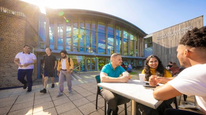 Group of students sat outside the students union